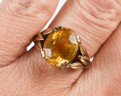 Lot 112 - A vintage 9ct gold and citrine dress ring,...