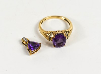 Lot 145 - A 9ct gold amethyst and paste dress ring, size...