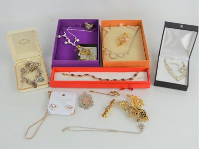 Lot 221 - A silver charm bracelet with various charms,...