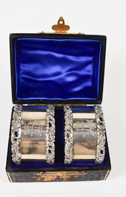 Lot 150 - A pair of late Victorian silver napkin rings,...