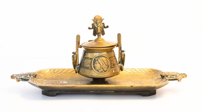 Lot 114 - An Egyptian Revival brass inkstand, the cover...