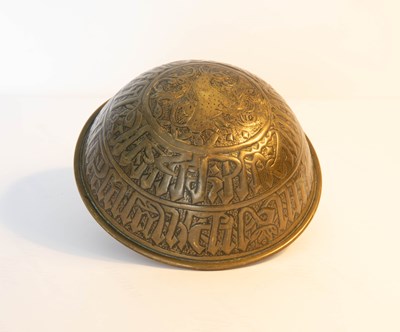 Lot 524 - An antique brass repousse finger bowl,...