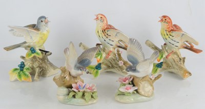 Lot 83 - A group of porcelain bird figures to include...