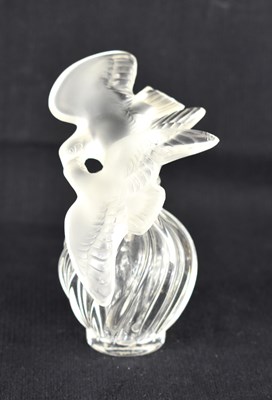 Lot 173 - A Lalique scent or perfume bottle, the body of...