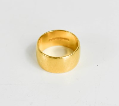 Lot 236 - A 22ct gold wedding band, size J, 8.56g.