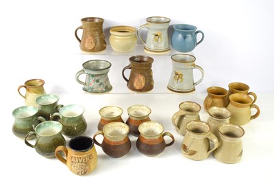 Lot 32 - A group of studio pottery mugs to include...