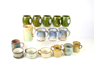 Lot 35 - A collection of studio pottery mugs to include...