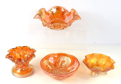 Lot 228 - A group of four pieces of marigold glass,...