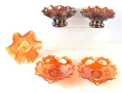 Lot 229 - A pair of amethyst carnival glass pedestal...