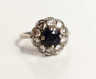 Lot 264 - A rose cut diamond and sapphire flowerhead...