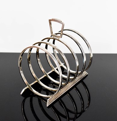 Lot 428 - A Scottish silver Art Deco toast rack, having...