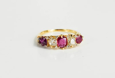 Lot 262 - An 18ct gold, ruby and diamond five stone ring,...