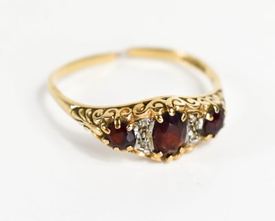 Lot 74 - A 9ct gold three stone ring, set with...