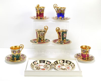 Lot 224 - A set of four Vienna porcelain coffee cans and...