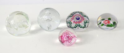 Lot 180 - A group of five glass paperweights, including...