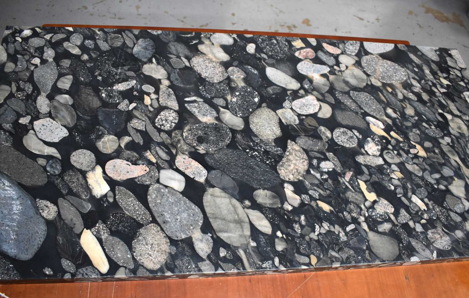 Lot 154 - A marble slab of pebble design, 59cm by