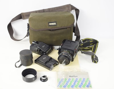 Lot 437 - A vintage Mamiya M645 1000S camera with some...