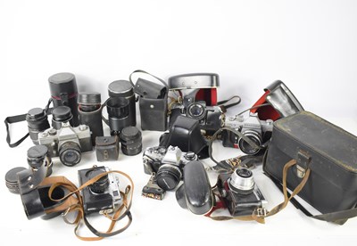 Lot 434 - A group of vintage cameras and lenses to...