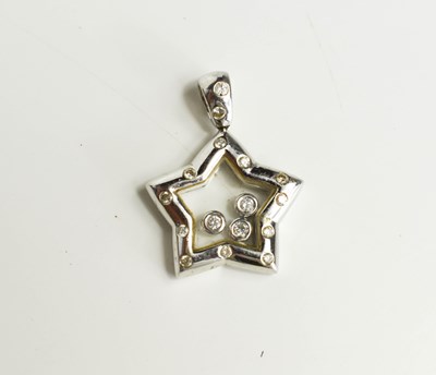 Lot 5 - An 18ct white gold floating diamond star...