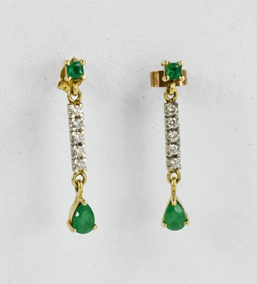 Lot 11 - A pair of 14ct gold, diamond and emerald drop...