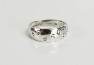 Lot 12 - A 9ct white gold and diamond ring, the...