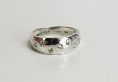 Lot 12 - A 9ct white gold and diamond ring, the...