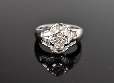Lot 13 - An 18ct white gold and diamond dress ring,...