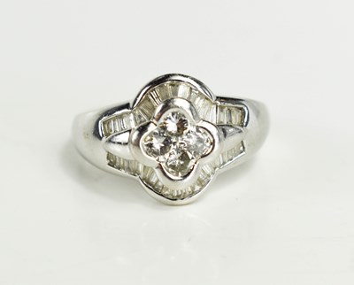 Lot 13 - An 18ct white gold and diamond dress ring,...