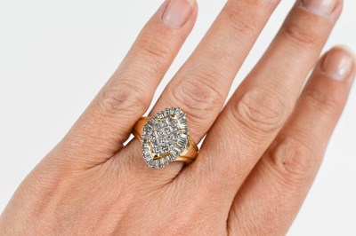 Lot 15 - A 14ct gold and diamond dress ring, the...