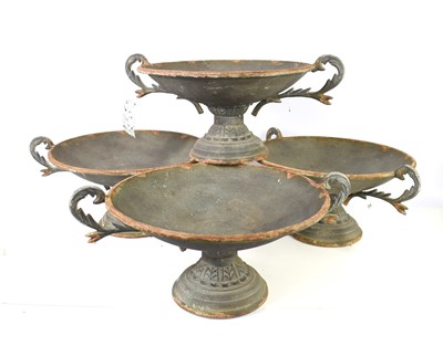 Lot 513 - A group of four metal shallow urns in the...