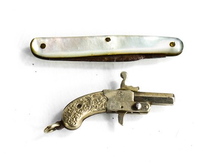 Lot 115 - A 19th century white metal miniature pistol...