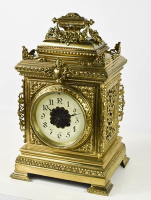 Lot 301 - A 1920s brass mantle clock, cast with a...