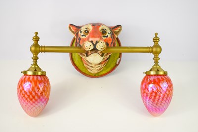 Lot 503 - A kitsch wall sconce in the form of a tiger...