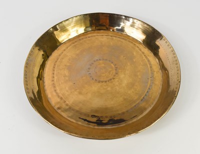 Lot 295 - An early bronze dish, bearing punchwork...