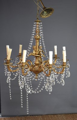 Lot 506 - A gilt metal nine branch chandelier with...