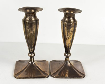 Lot 288 - A pair of continental white metal candlesticks,...