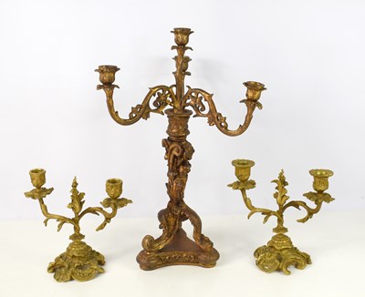 Lot 500 - A resin three branch candelabra in the Rocco...