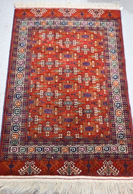 Lot 488 - A Middle Eastern rug, with dark orange ground,...