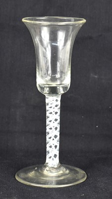 Lot 261 - An 18th century wine glass with double air...