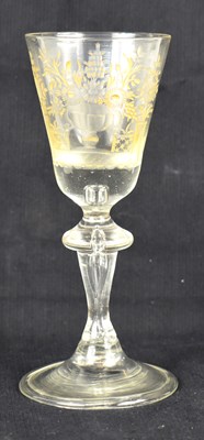 Lot 259 - An 18th century wine glass, engraved and...