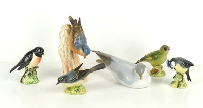 Lot 207 - A group of porcelain birds to include examples...