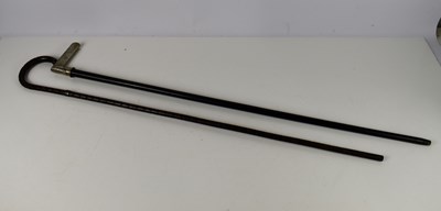 Lot 311 - Two vintage walking canes to include a bamboo...