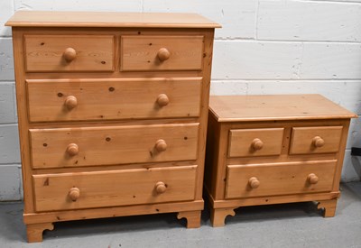 Lot 551 - A pine two over three chest of drawers...