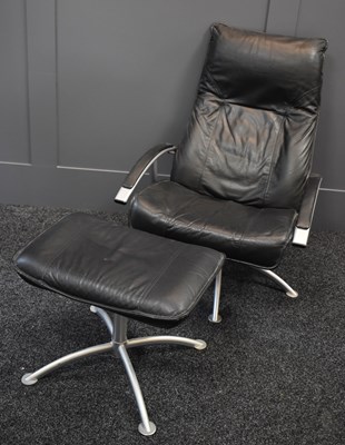 Lot 151 - A black leather and chromed lazy boy armchair...