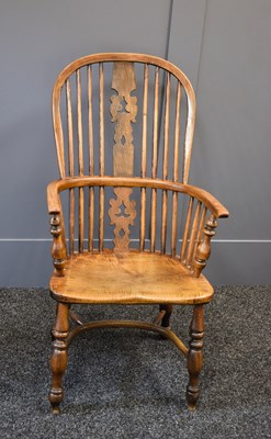 Lot 559 - A 19th century Windsor elm armchair, with hoop...