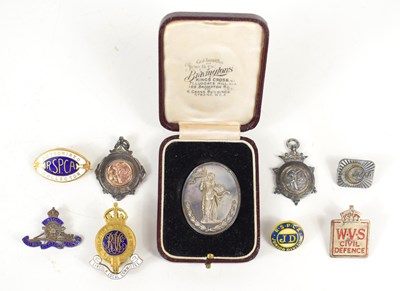 Lot 212 - A group of badges and medals to include a...