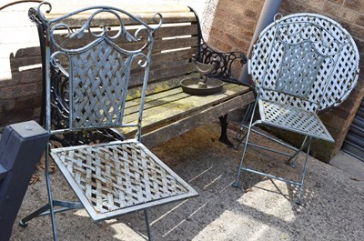 Lot 519 - A blue painted wrought iron garden table and...