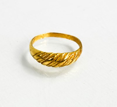 Lot 104 - A gold (indistinctly hallmarked) ring, size R,...