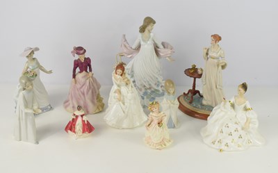 Lot 194 - A group of porcelain figures to include...