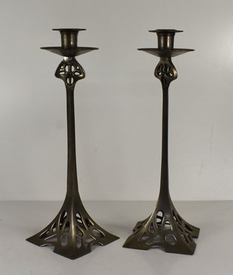 Lot 110 - A pair of Art Nouveau metal candlesticks with...
